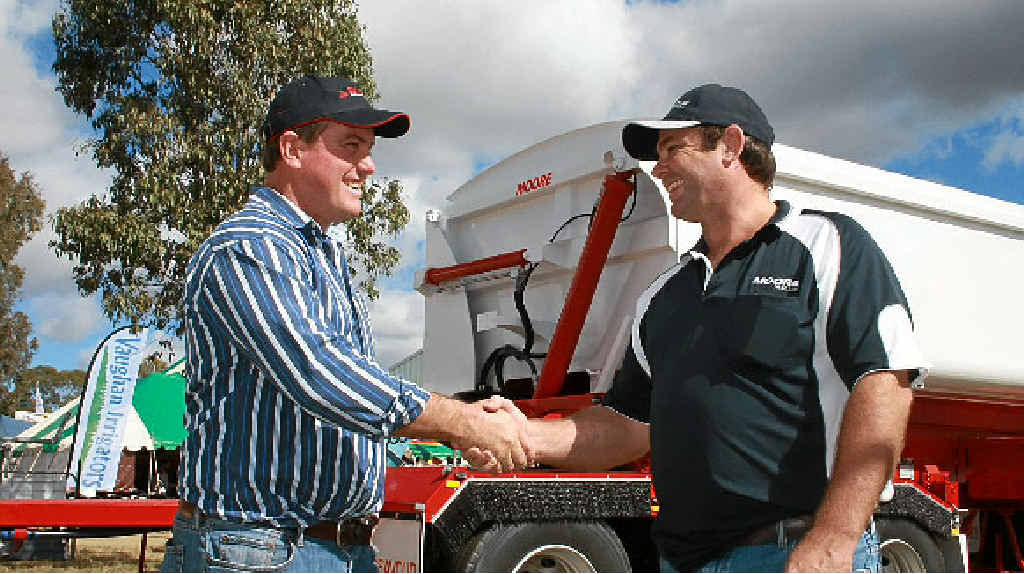 HANDOVER: Scott Stallman and Shayne Moore shake hands after Scott becomes the owner of the trailers. HANDOVER: Scott Stallman and Shayne Moore shake hands after Scott becomes the owner of the trailers.